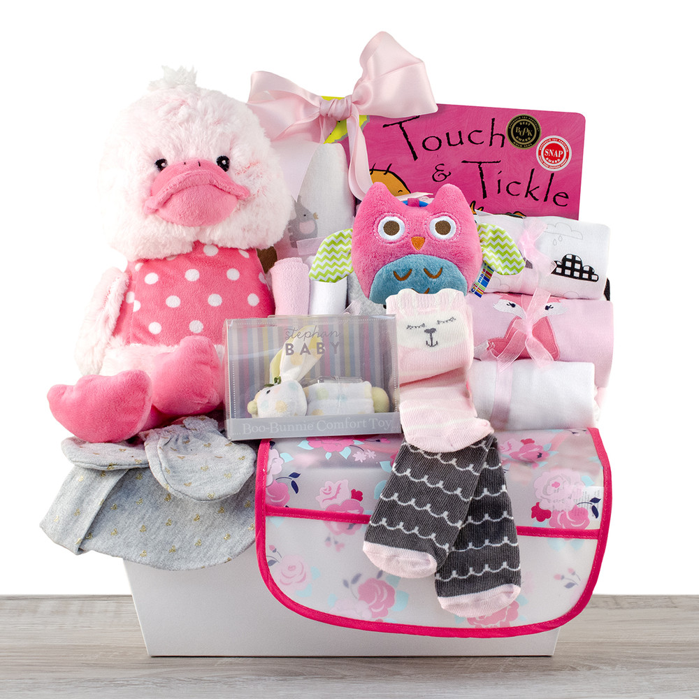 purple teddy bear, blankets, socks and nursery book in white pink bucket gift
